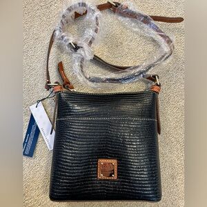 Dooney & Bourke NWT midnight blue letter Carrier crossbody bag. 8x9”